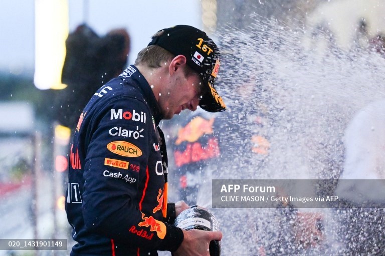 Verstappen wins chaotic, rain-shortened Japanese GP to clinch title