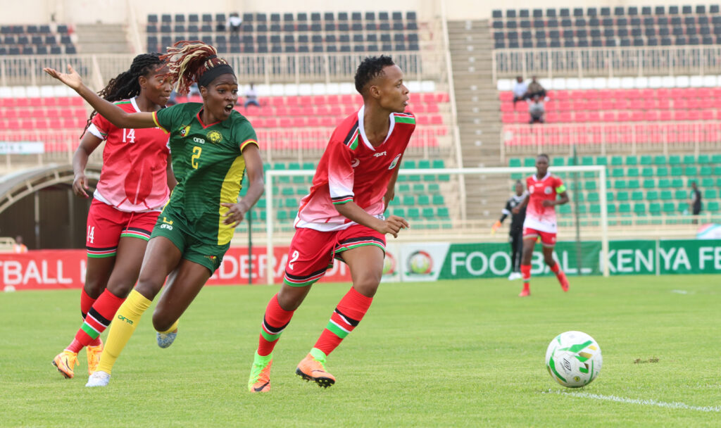 Catch me if you can! Mwanahalima Adam steams away from Cameroon's Easther Mayi Kith. PHOTO/Timothy Olobulu