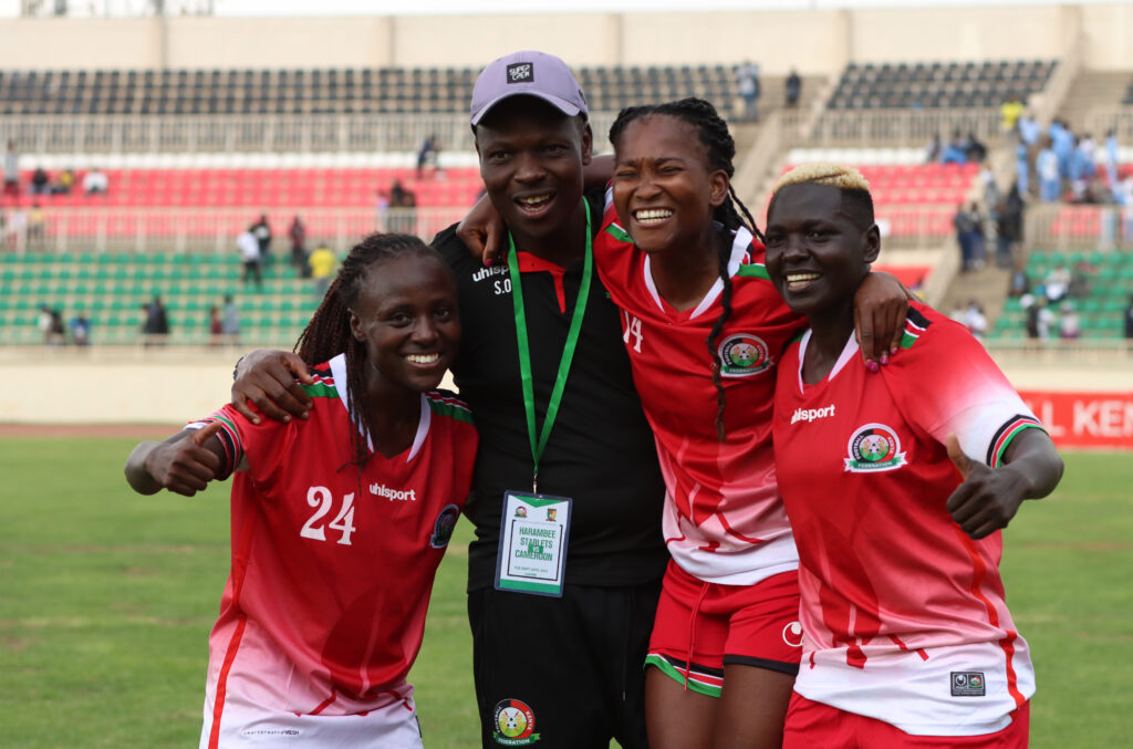 Coach Stanley Okumbi celebrates with Enez Mango, Esse Akida and Phoebe Okumu. PHOTO/Timothy Olobulu